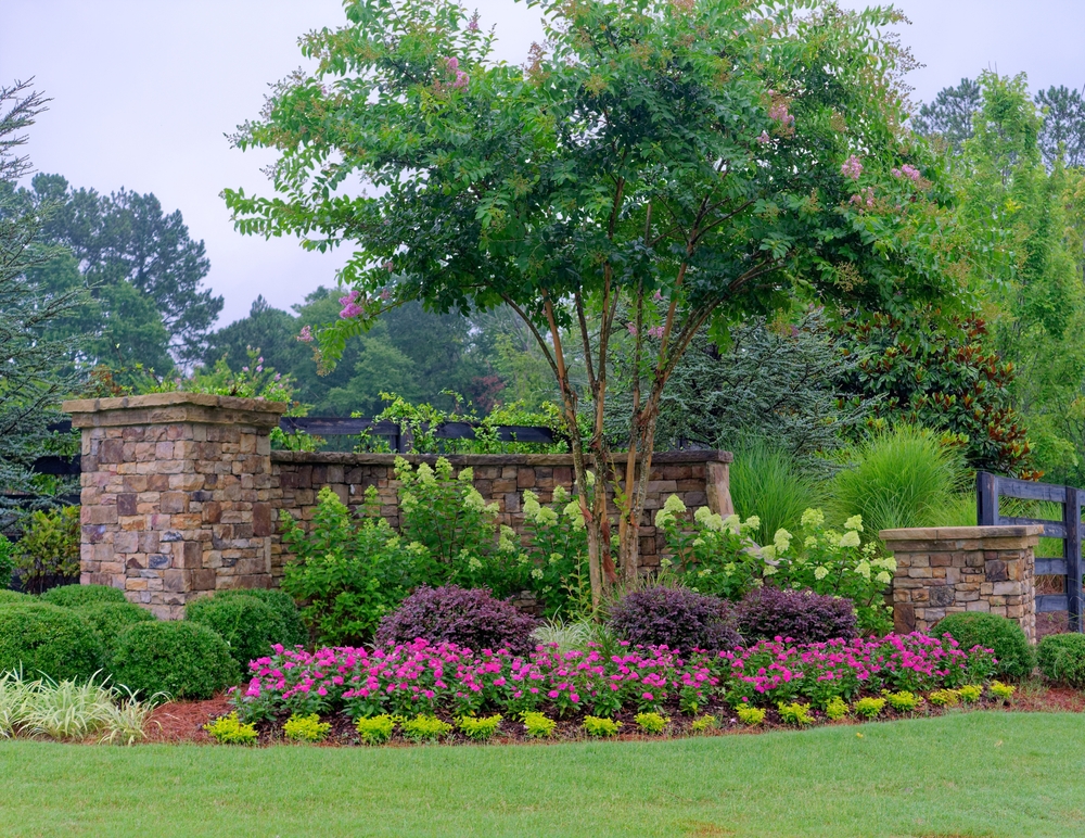 well-maintained landscaping for single family hoa neighborhood entrance